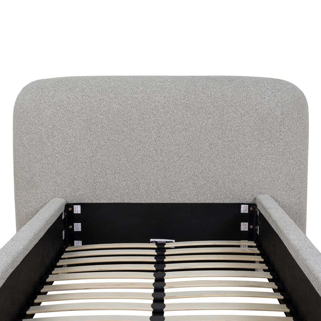 Gray upholstered bed frame with wooden slats on a white background