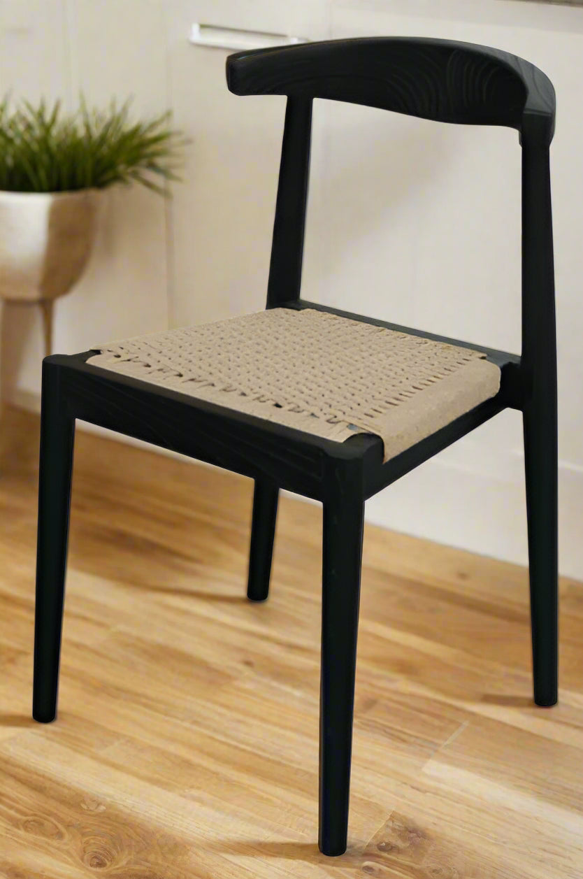 Black chair with a woven seat on a white background