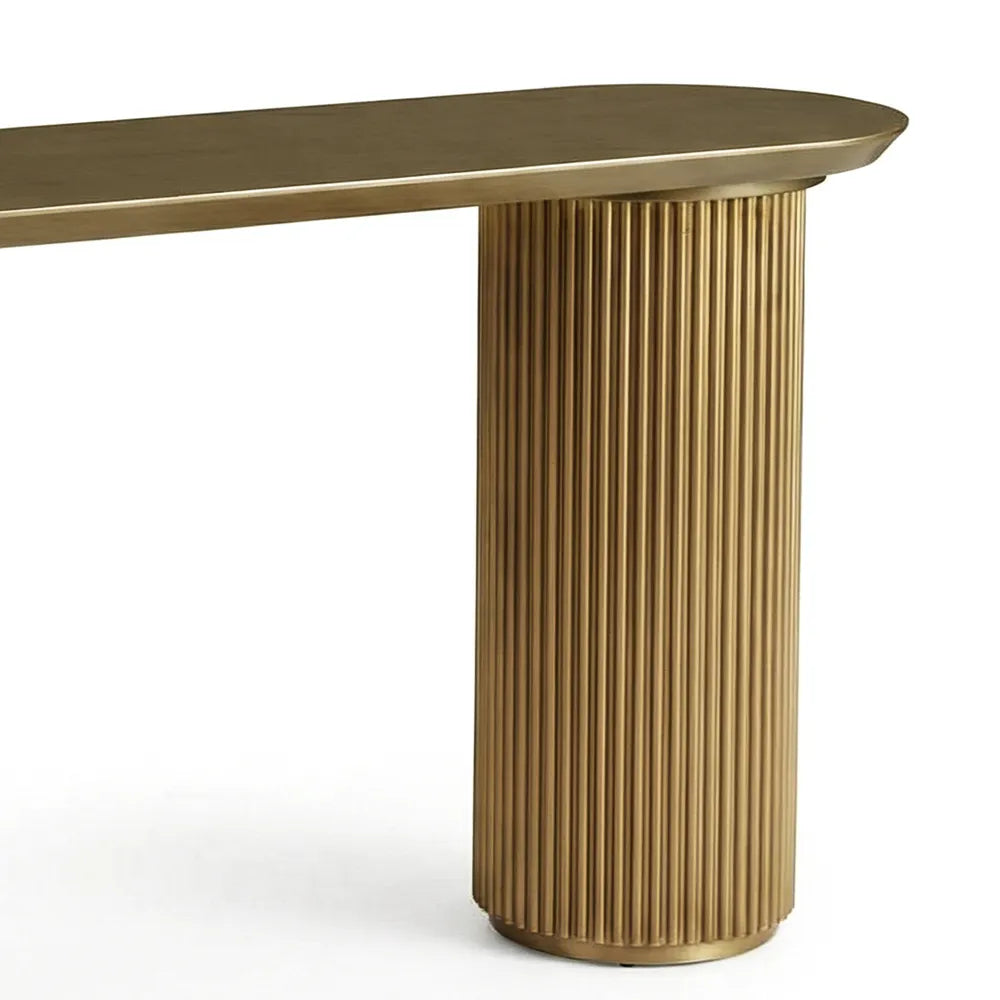 Gold dining table with ribbed cylindrical base