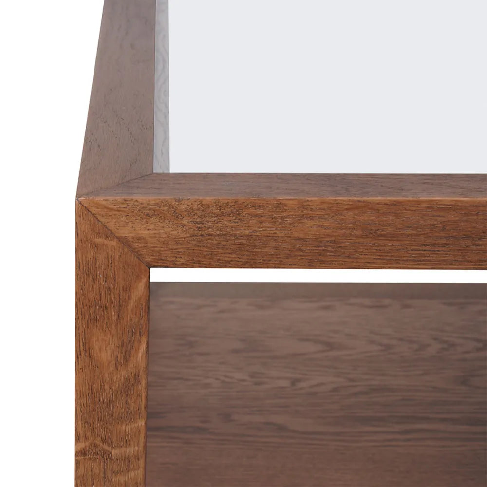 Close-up of a wooden shelf with a white background