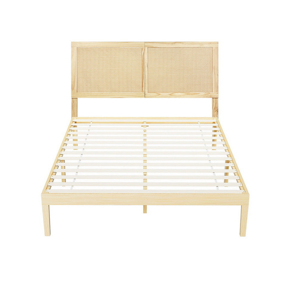Wooden bed frame with woven headboard on a white background