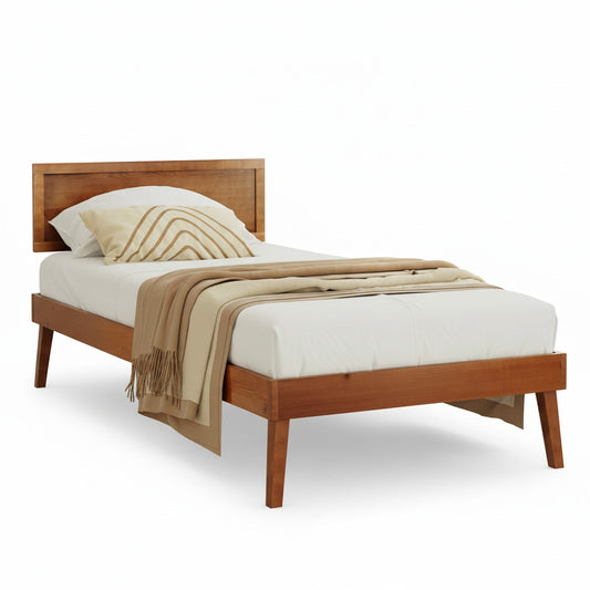 Wooden bed with white bedding and a beige throw blanket in a bedroom setting.