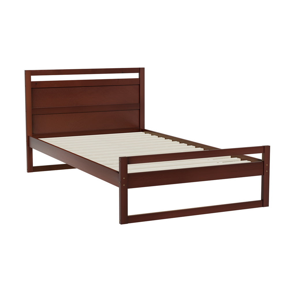 Wooden bed frame with white mattress on a white background