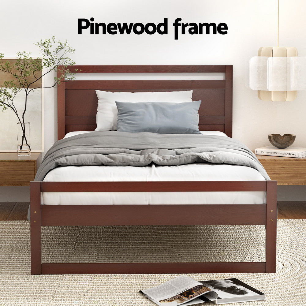 Wooden bed frame with bedding in a bedroom setting